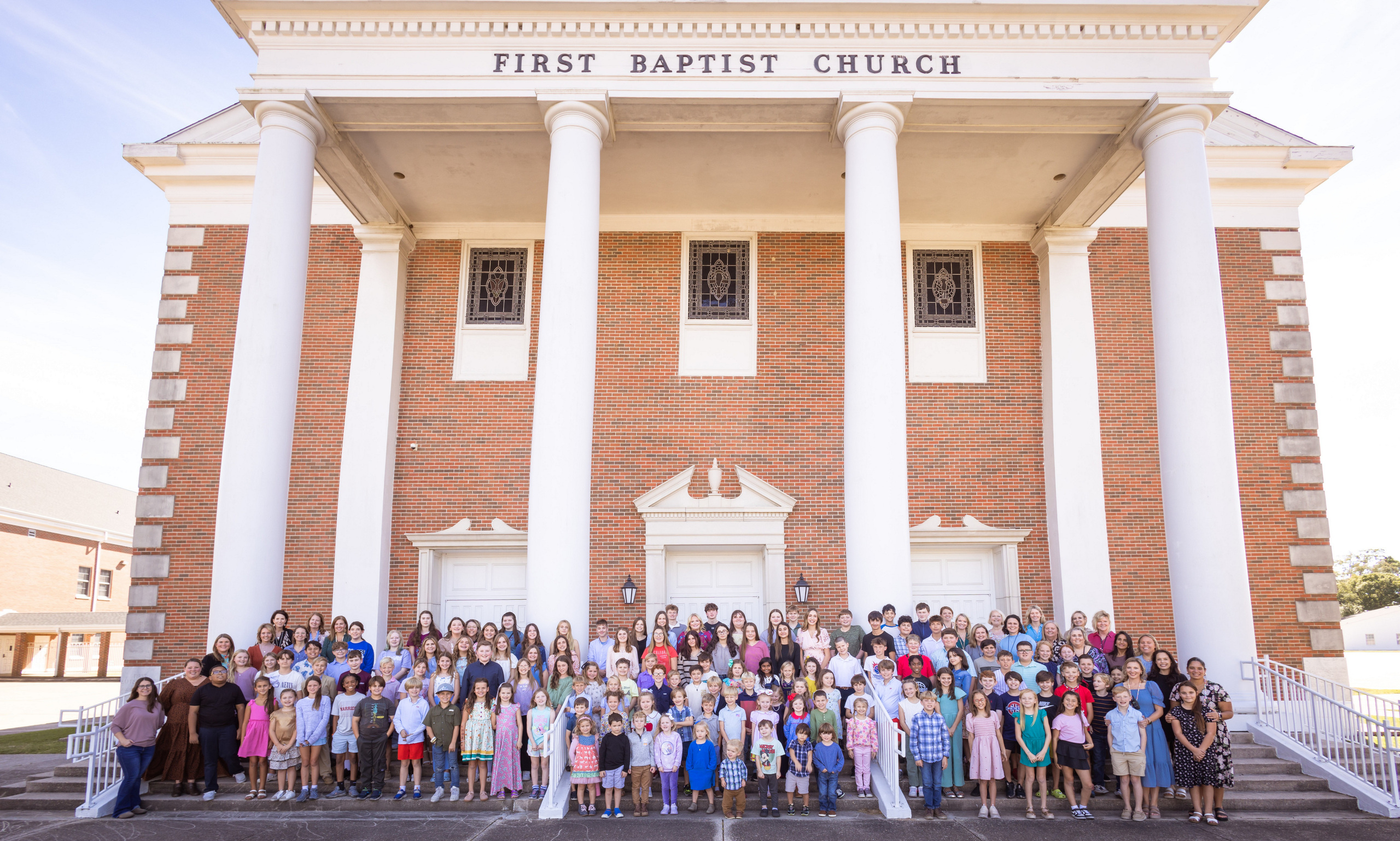 Trinity Classical Academy students and teachers gathered on the steps of First Baptist Church